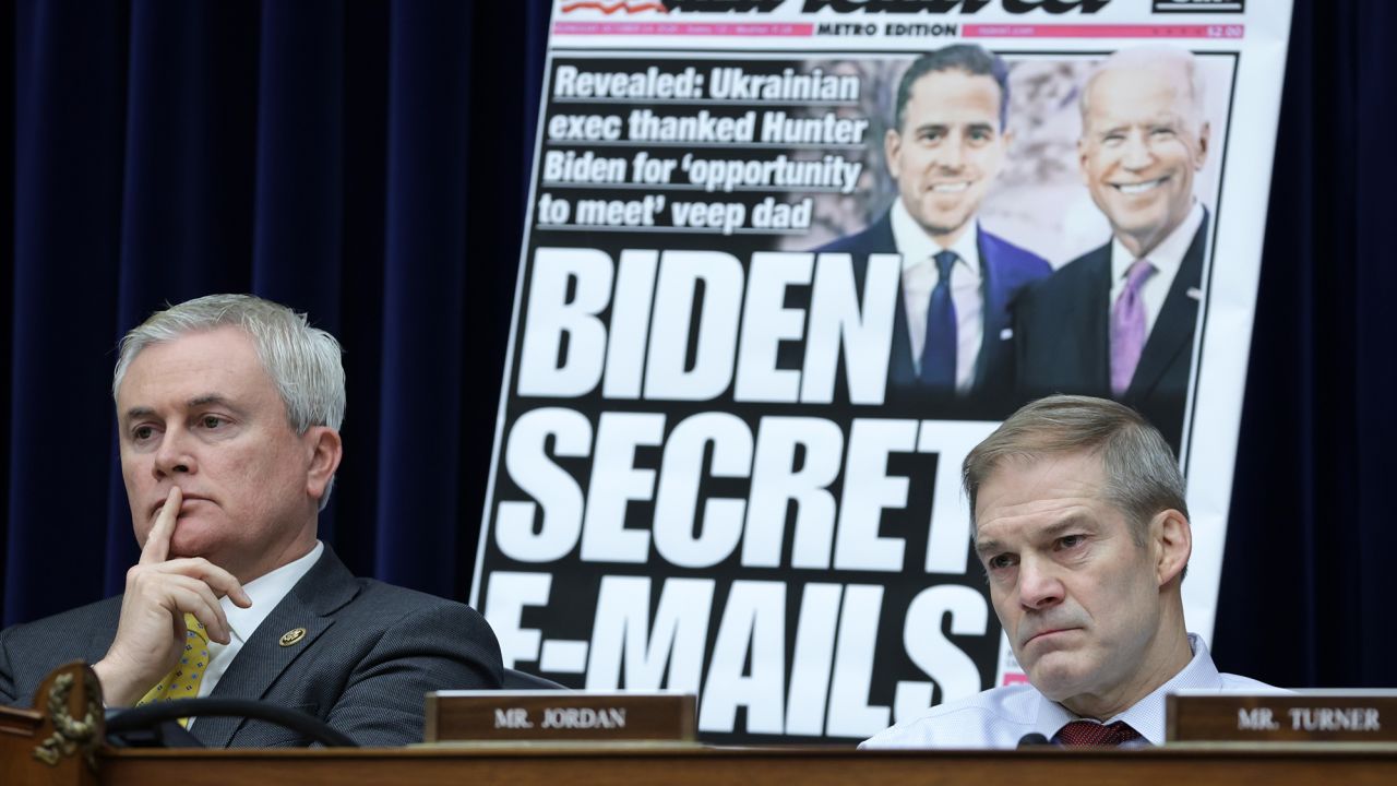 With a poster of a New York Post front page story about Hunter Biden's emails on display, Committee Chairman Rep. James Comer and Rep. Jim Jordon listen during a hearing before the House Oversight and Accountability Committee at Rayburn House Office Building on Capitol Hill on February 8 in Washington, DC.